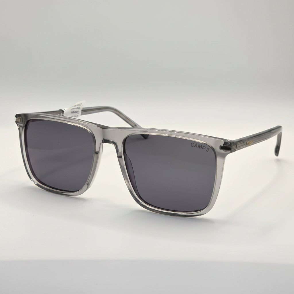 Sunglasses with dark lenses and silver frame on a white background
