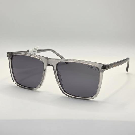 Sunglasses with dark lenses and silver frame on a white background